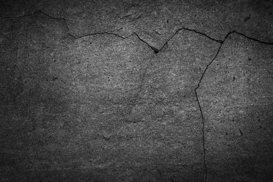 Cracks on a black cement floor